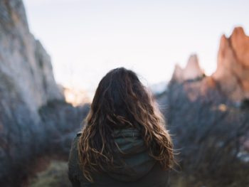 woman in front of mountain